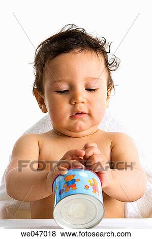 Toddler playing with a toy View Large Photo Image Stock Photo - Toddler playing with a toy. Fotosearch