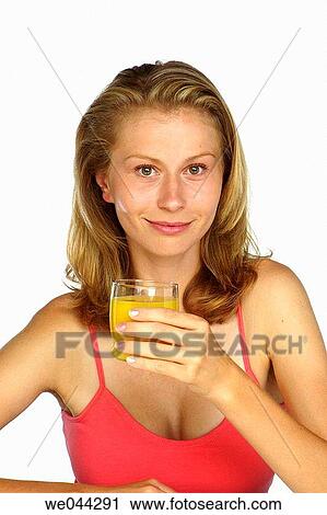 Woman drinking orange juice View Large Photo Image Stock Image - Woman drinking orange juice. Fotosearch