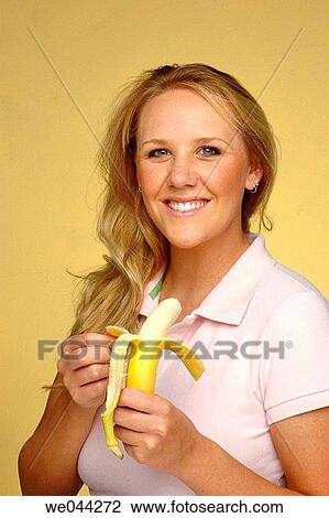 Woman eating a banana View Large Photo Image Stock Image - Woman eating a banana. Fotosearch