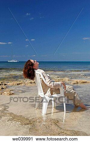 Woman resting on the beach. Cozumel, Mexico View Large Photo Image Stock Image - Woman resting on the beach. Cozumel, Mexico. Fotosearch