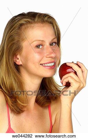 Woman with a apple View Large Photo Image Stock Image - Woman with a apple. Fotosearch