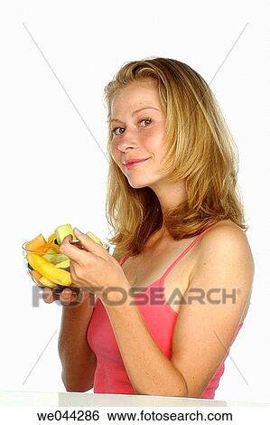 Woman with a bowl of fruit View Large Photo Image Stock Photograph - Woman with a bowl of fruit. Fotosearch