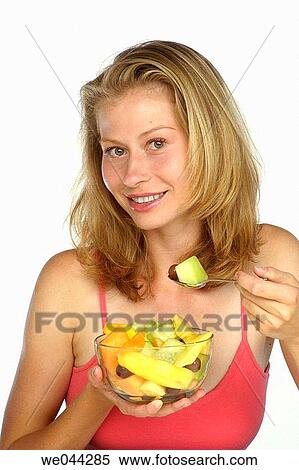 Woman with a bowl of fruit View Large Photo Image Stock Photography - Woman with a bowl of fruit. Fotosearch