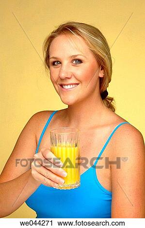 Woman with orange juice View Large Photo Image Stock Image - Woman with orange juice. Fotosearch