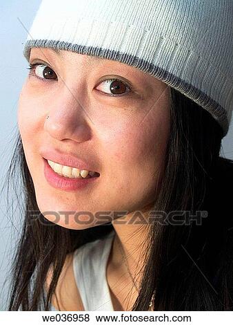 young good looking asian girl wearing a winter hat. View Large Photo Image Stock Photo - young good looking asian girl wearing a winter hat.. Fotosearch