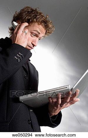 Picture - 30's, businesspeople, businessman, balance, 20's. Fotosearch
