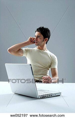 Stock Photo - 30's, calling, business, 20's. Fotosearch