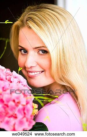 Picture - 30's, carrying, carry, blond, 20's. Fotosearch