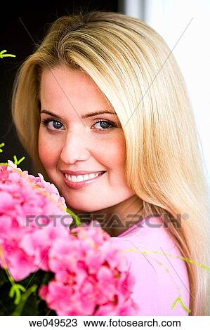 Stock Image - 30's, carrying, carry, blond, 20's. Fotosearch