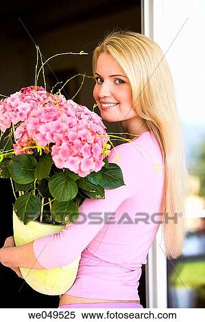 Stock Photography - 30's, carrying, carry, blond, 20's. Fotosearch