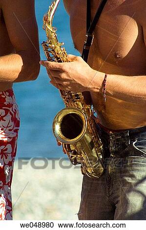 Stock Image - a musician in France in one of Mediterranean resorts. Fotosearch