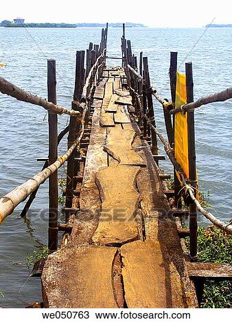 A wooden Landing stage (bridge) for Ferryboats leading towards a Dock. Ernakulam (Cochin) Kerala, India. View Large Photo Image Stock Image - A wooden Landing stage (bridge) for Ferryboats leading towards a Dock. Ernakulam (Cochin) Kerala, India.. Fotosearch