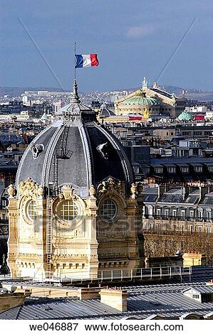 Aerial view of the domed Tribunal de Commerce with French flag and Garnier Op? ra in the background. Paris. France View Large Photo Image Stock Photo - Aerial view of the domed Tribunal de Commerce with French flag and Garnier Op? ra in the background. Paris. France. Fotosearch