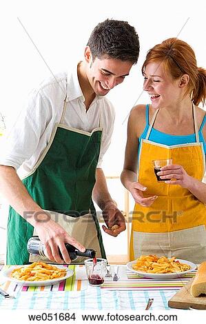 Picture - amusement, Best friend, at-home, apron, 20's. Fotosearch