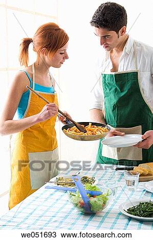 amusement, Best friend, at-home, apron, 20's View Large Photo Image Stock Image - amusement, Best friend, at-home, apron, 20's. Fotosearch