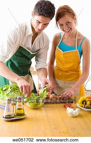 Stock Image - amusement, Best friend, at-home, apron, 20's. Fotosearch