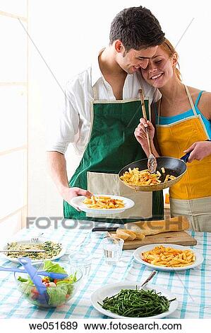 amusement, Best friend, at-home, apron, 20's View Large Photo Image Stock Photo - amusement, Best friend, at-home, apron, 20's. Fotosearch