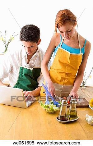 amusement, Best friend, at-home, apron, 20's View Large Photo Image Stock Photo - amusement, Best friend, at-home, apron, 20's. Fotosearch