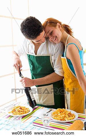 amusement, Best friend, at-home, apron, 20's View Large Photo Image Stock Photograph - amusement, Best friend, at-home, apron, 20's. Fotosearch