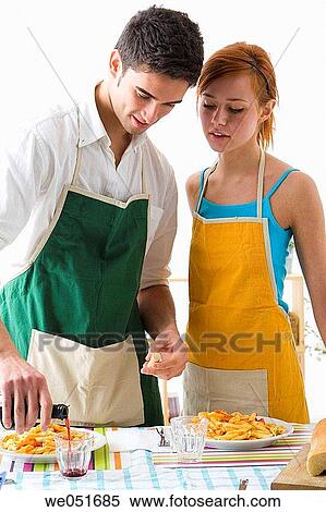 Stock Photography - amusement, Best friend, at-home, apron, 20's. Fotosearch