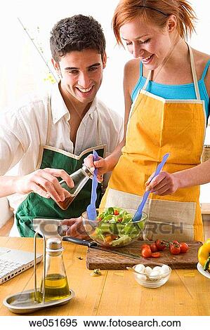 amusement, Best friend, at-home, apron, 20's View Large Photo Image Stock Photography - amusement, Best friend, at-home, apron, 20's. Fotosearch