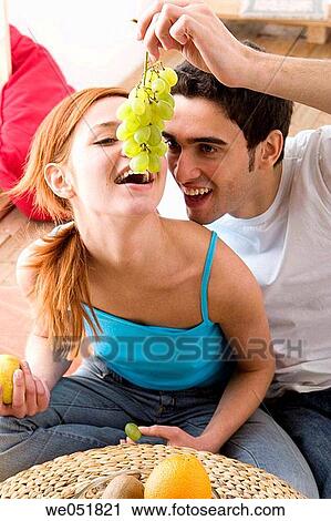 Stock Image - apple, bowl, at-home, Arms raised, 20's. Fotosearch