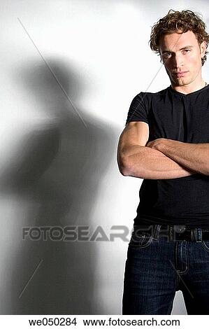 Arms crossed, boy, blue eyes, arms folded, 20's View Large Photo Image Picture - Arms crossed, boy, blue eyes, arms folded, 20's. Fotosearch