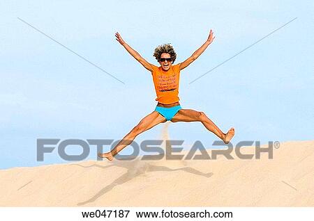 Arms raised, beach, action View Large Photo Image Stock Photo - Arms raised, beach, action. Fotosearch