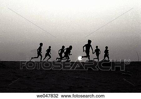 Around 12 years old boys playing soccer in the beach. Brazil. View Large Photo Image Stock Image - Around 12 years old boys playing soccer in the beach. Brazil.. Fotosearch