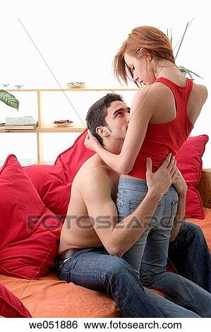 Stock Photograph - at-home, bond, black hair, attraction, affection. Fotosearch