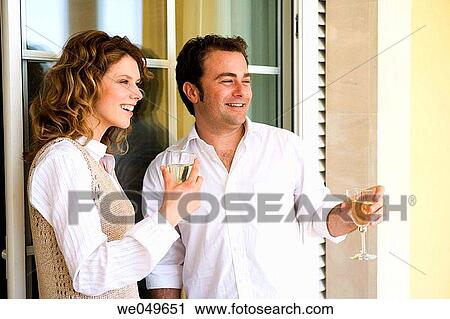 Stock Image - at-home, chat, 30's. Fotosearch