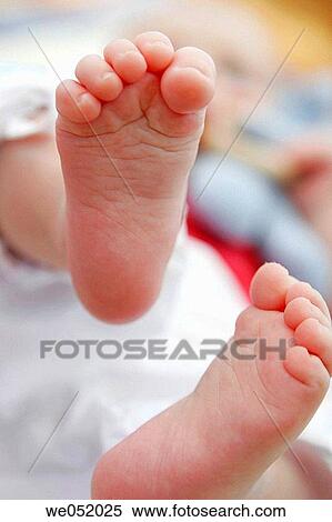 Stock Photography - baby, barefoot, child, Close-up, contemporary. Fotosearch