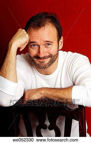 Stock Image - baby boomer, beard, black hair. Fotosearch