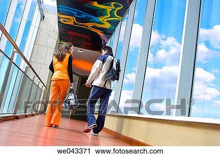 Stock Image - back view, chat, bag, 30's. Fotosearch