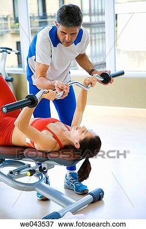 Stock Photo - barbell, coach, aid. Fotosearch