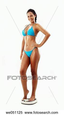 Bathroom scale, brunette, 20's View Large Photo Image Stock Photography - Bathroom scale, brunette, 20's. Fotosearch