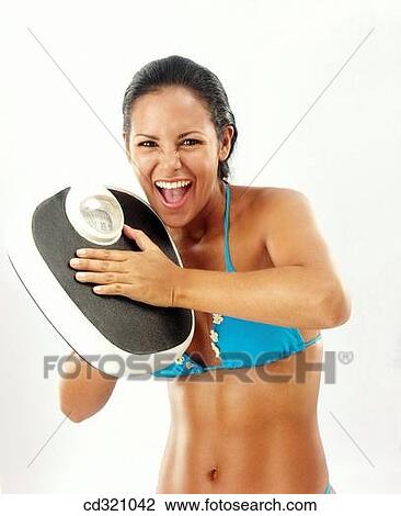 Bathroom scale, clipping path, brunette, 20's View Large Photo Image Stock Image - Bathroom scale, clipping path, brunette, 20's. Fotosearch