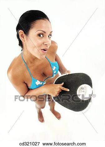 Bathroom scale, clipping path, brunette, 20's View Large Photo Image Stock Photo - Bathroom scale, clipping path, brunette, 20's. Fotosearch