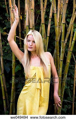 Picture - blond, contemporary, Arms raised. Fotosearch