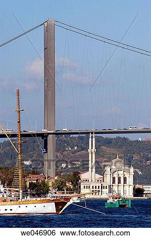 Stock Photograph - Bosphorus Bridge, Buyuk Mecidiye Mosque and sail boat. Istanbul. Turkey. Fotosearch
