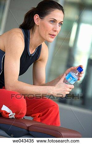 bottle, brunette, break-time, break, absorbed View Large Photo Image Stock Photography - bottle, brunette, break-time, break, absorbed. Fotosearch