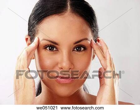 Stock Image - brunette, chilling out, Close-up, concentrate. Fotosearch