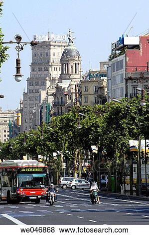 Bus and motorcycles on Passeig de Gracia avenue. Barcelona. Spain View Large Photo Image Stock Photo - Bus and motorcycles on Passeig de Gracia avenue. Barcelona. Spain. Fotosearch