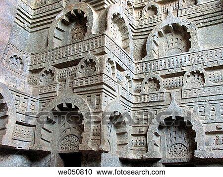 Stock Image - Carved wall of Buddhist Bedsa caves are 1000 years old. Bedsa, Maharashtra, India. Fotosearch