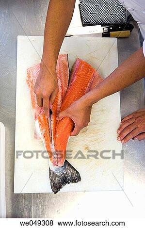 Stock Photo - Chefs cutting salmon. Luis Irizar cooking school. Donostia, Gipuzkoa, Basque Country, Spain. Fotosearch