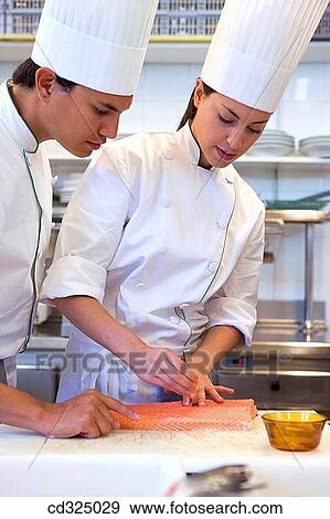 Stock Photo - Chefs desespinando salmon. Luis Irizar cooking school. Donostia, Gipuzkoa, Basque Country, Spain. Fotosearch