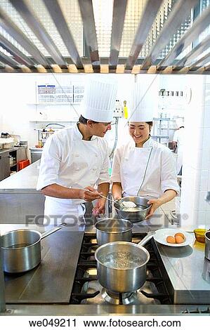 Stock Image - Cooking poached eggs. Luis Irizar cooking school. Donostia, Gipuzkoa, Basque Country, Spain. Fotosearch