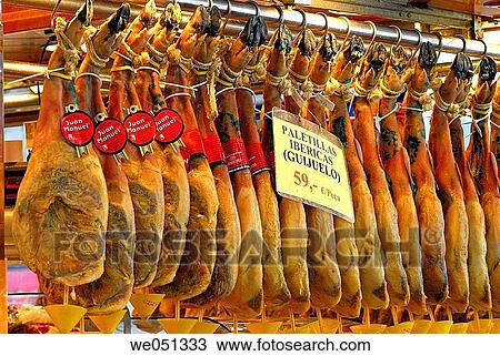 Stock Image - Cured hams at La Boqueria market, Barcelona. Catalonia, Spain. Fotosearch