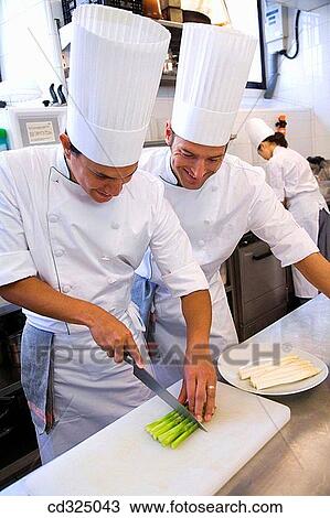 Stock Image - Cutting asparagus. Luis Irizar cooking school. Donostia, Gipuzkoa, Basque Country, Spain. Fotosearch