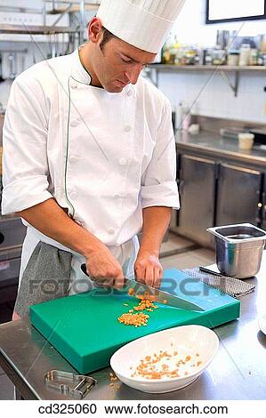 Cutting carrots. Luis Irizar cooking school. Donostia, Gipuzkoa, Basque Country, Spain View Large Photo Image Stock Image - Cutting carrots. Luis Irizar cooking school. Donostia, Gipuzkoa, Basque Country, Spain. Fotosearch
